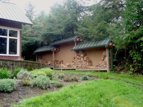 Privacy screen, and firewood shed.